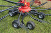 Curved tine arms offer more space for the swath. Curved tine arms offer more space for the swath.